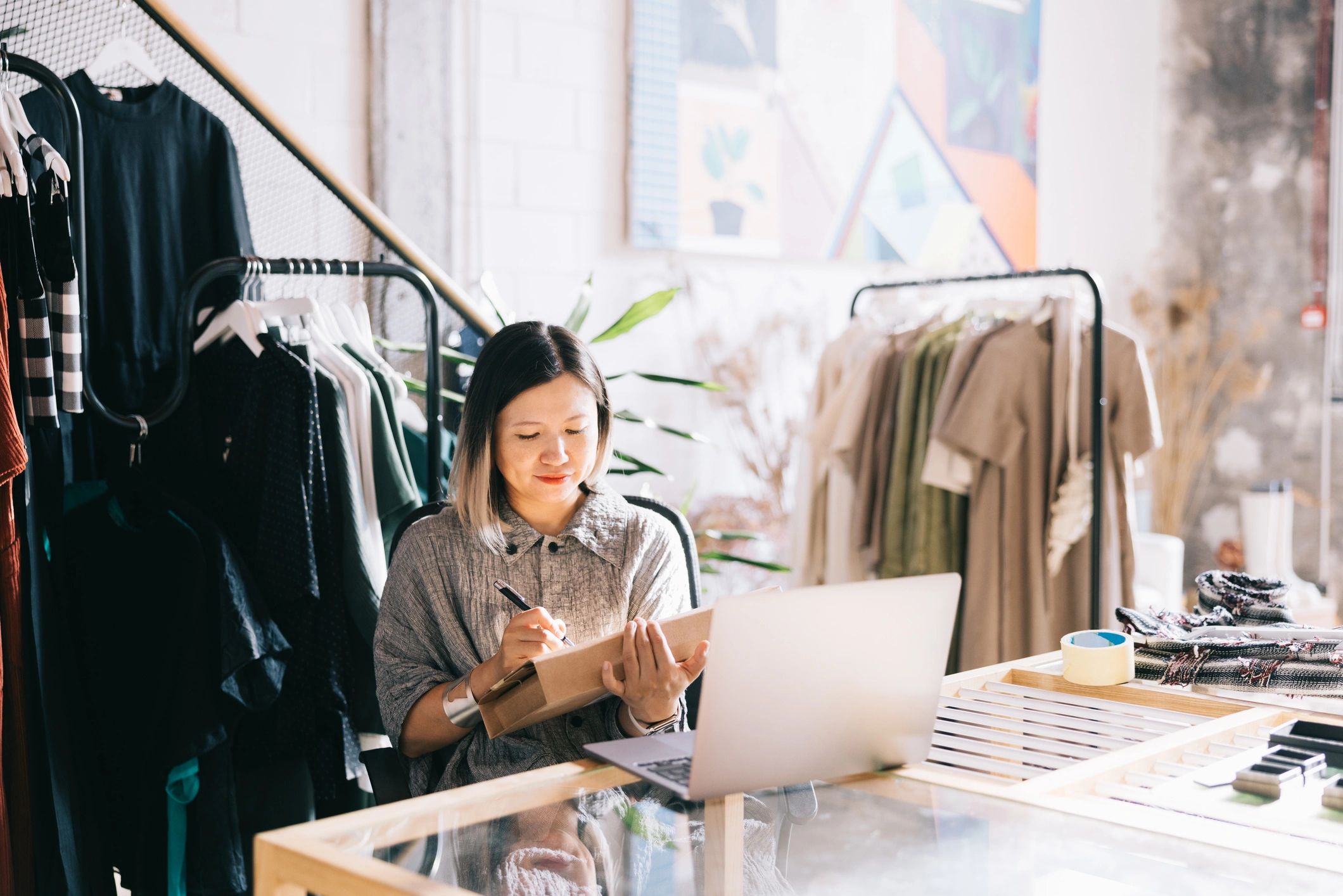 Boutique business owner preparing an order at her workspace